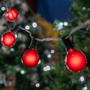 Picture of 25 G40 Globe String Light Set with Red Satin Bulbs on Black Wire