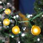 Picture of 100 G40 Globe String Light Set with Yellow Bulbs on Green Wire