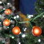 Picture of 25 G40 Globe String Light Set with Orange Satin Bulbs on Green Wire